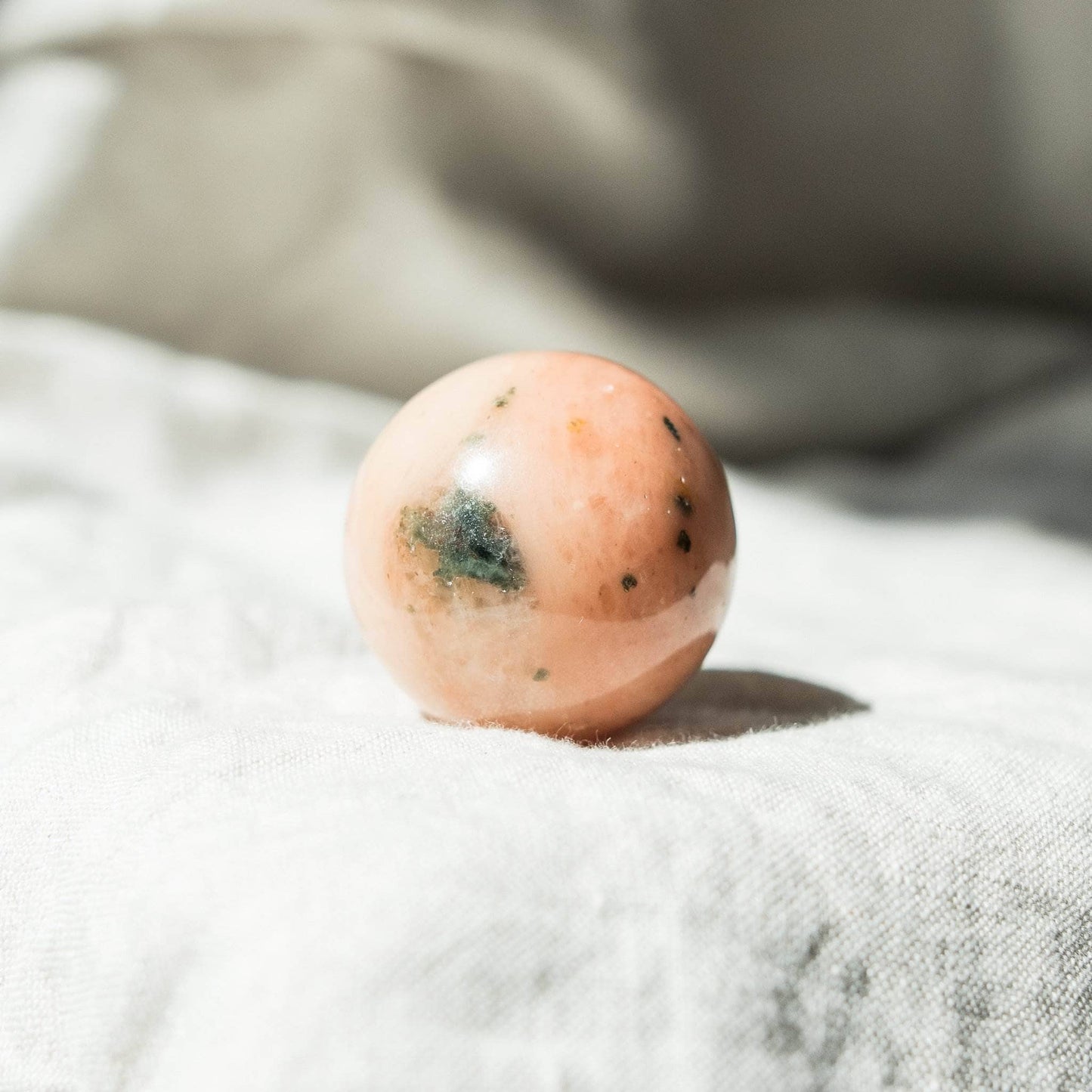 Orange Calcite Sphere with Tripod by Tiny Rituals