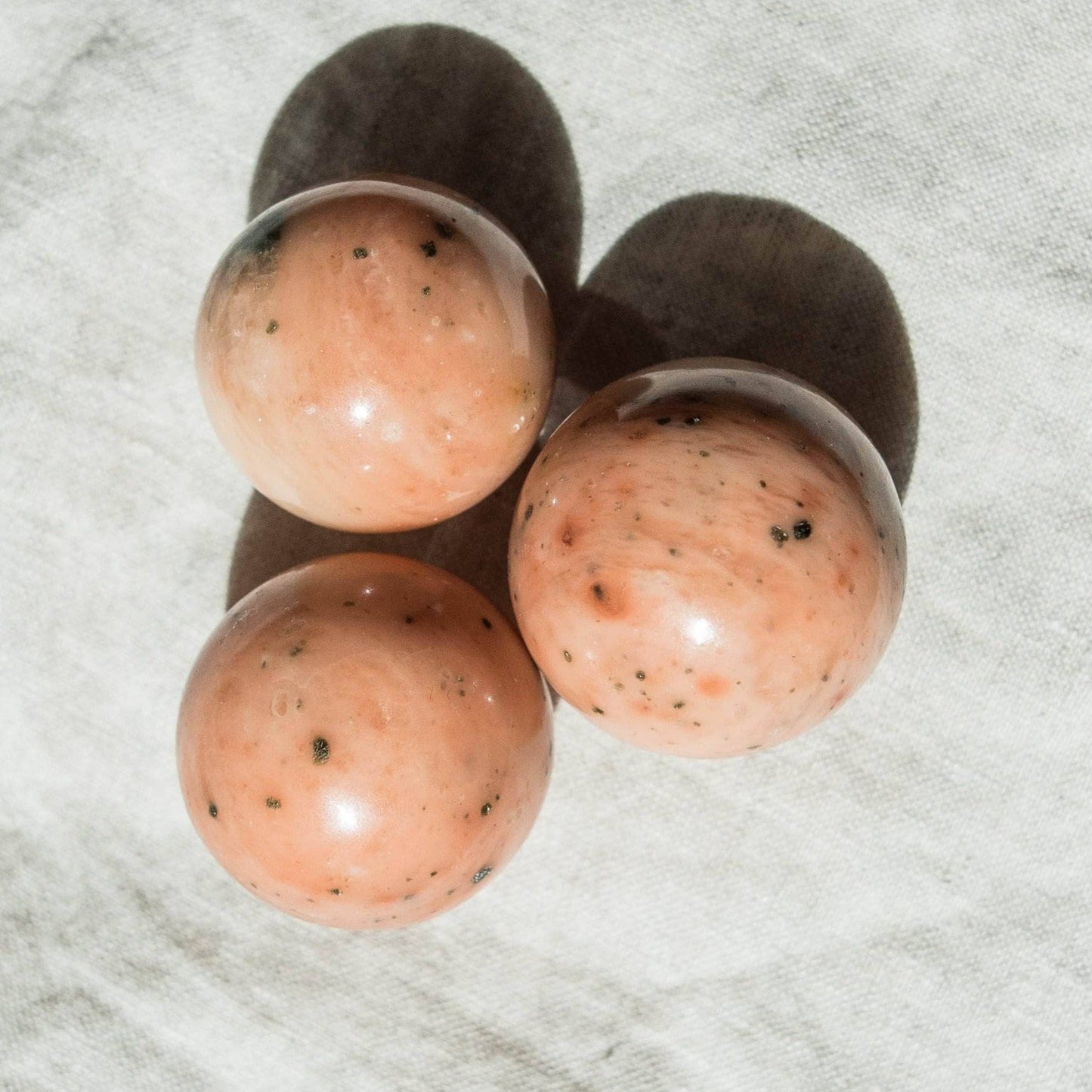 Orange Calcite Sphere with Tripod by Tiny Rituals