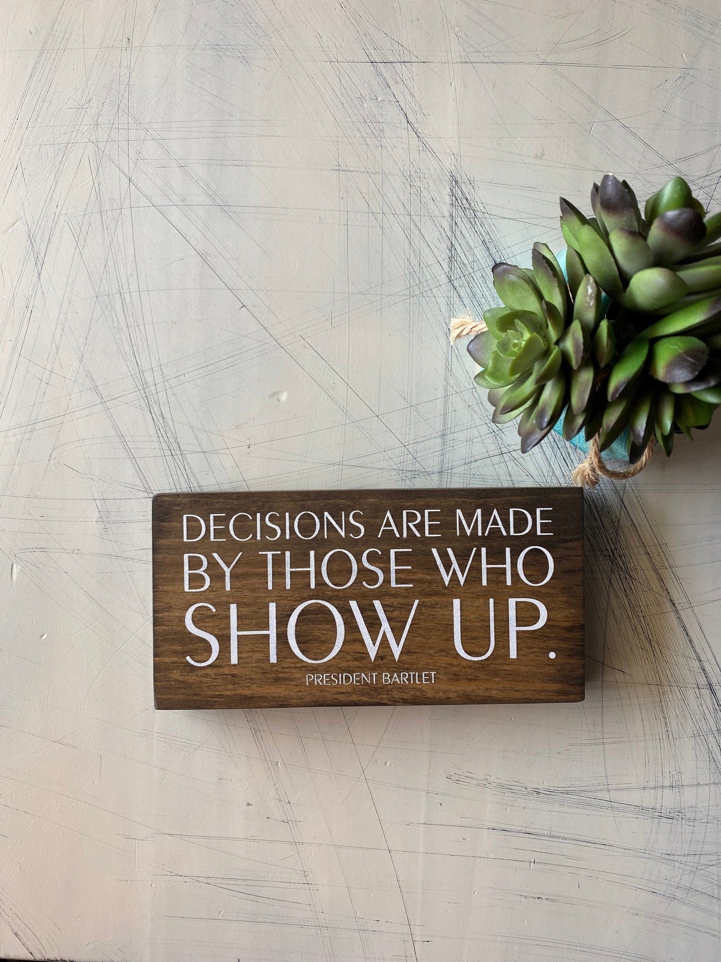 Decisions are made by those who show up. by Novotny Designs