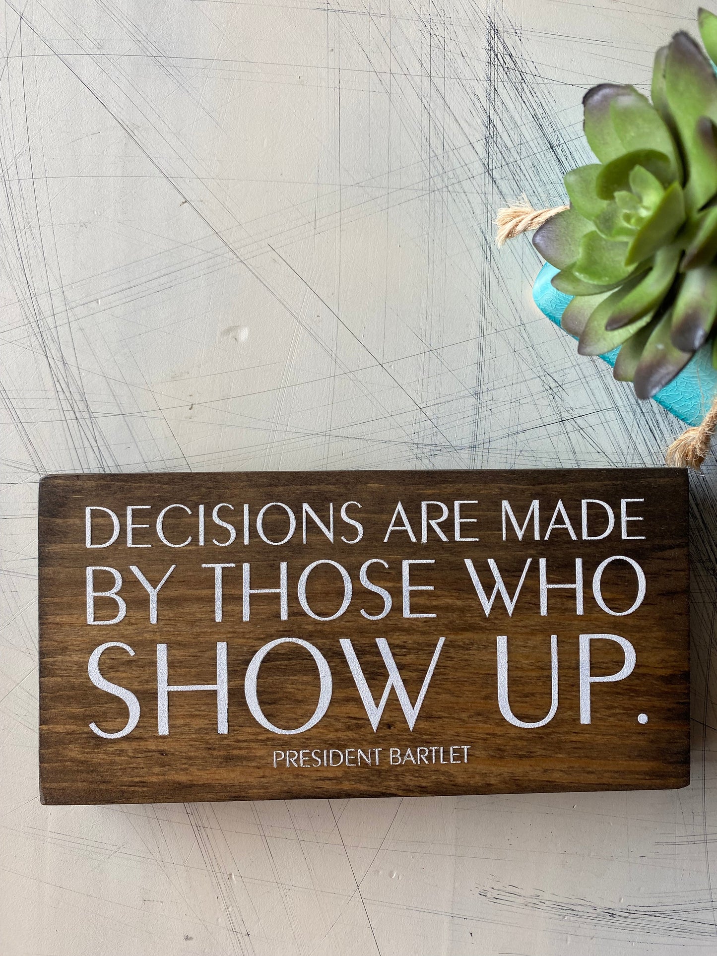 Decisions are made by those who show up. by Novotny Designs